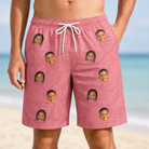 Model wearing Men's Tidal Trinkets Custom Face Beach Shorts printed with kids' faces