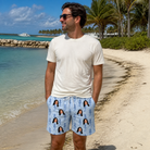 Real-life photo of someone wearing Men's Bridle Bubbles Custom Face Beach Shorts — custom faces printed all-over