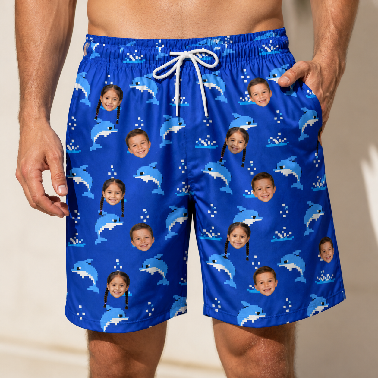 Model wearing Men's Porpoise Party Custom Face Beach Shorts printed with kids' faces