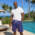 Real-life photo of someone wearing Men's Arum Around Custom Face Beach Shorts — custom faces printed all-over
