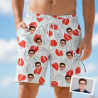 Man wearing Men's Heartleaf Heat Custom Face Beach Shorts — custom faces printed all-over