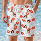 Model wearing Men's Heartleaf Heat Custom Face Beach Shorts printed with kids' faces