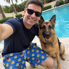 Selfie with the pet whose face is printed all over this Men's Bark Bath Custom Dog Face Beach Shorts