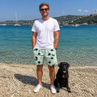 Full-length photo with the pet printed all over this Men's Kerchief Kapers Custom Dog Face Beach Shorts