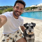 Selfie with the pet whose face is printed all over this Men's Woof Whimsy Custom Dog Face Beach Shorts