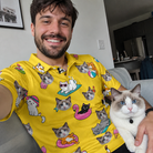 Selfie with the pet whose face is printed all over this Men's Velvet Nuzzles Custom Cat Face Polo Shirt