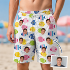 Man wearing Men's Guppy Gyrations Custom Face Beach Shorts — custom faces printed all-over