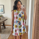 Real-life photo of someone wearing Women's Guppy Gyrations Custom Face Tank Dress — custom faces printed all-over