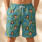 Model wearing Men's Bamboo Boogie Custom Face Beach Shorts printed with kids' faces