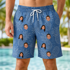 Model wearing Men's Golden Gush Custom Face Beach Shorts printed with kids' faces
