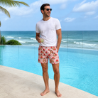 Real-life photo of someone wearing Men's Watermelon Whimsy Custom Face Beach Shorts — custom faces printed all-over
