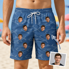 Man wearing Men's Finny Business Custom Face Beach Shorts — custom faces printed all-over