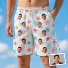 Man wearing Men's Threaded Thrills Custom Face Beach Shorts — custom faces printed all-over