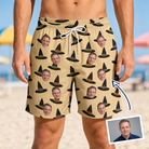 Man wearing Men's Coven Couture Custom Face Beach Shorts — custom faces printed all-over