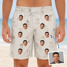 Man wearing Men's Santa Satchels Custom Face Beach Shorts — custom faces printed all-over