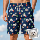 Man wearing Men's December Dangles Custom Dog Face Beach Shorts — custom faces printed all-over