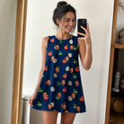 Real-life photo of someone wearing Women's December Dangles Custom Face Tank Dress — custom faces printed all-over