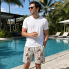 Real-life photo of someone wearing Men's Pennant Parade Custom Face Beach Shorts — custom faces printed all-over