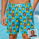 Man wearing Men's Pineapple Pals Custom Face Beach Shorts — custom faces printed all-over