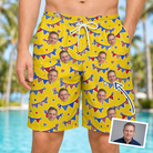 Man wearing Men's Banner Bash Custom Face Beach Shorts — custom faces printed all-over