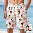 Man wearing Men's Anthurium Antics Custom Face Beach Shorts — custom faces printed all-over