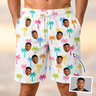 Man wearing Men's Jungle Jive Custom Face Beach Shorts — custom faces printed all-over