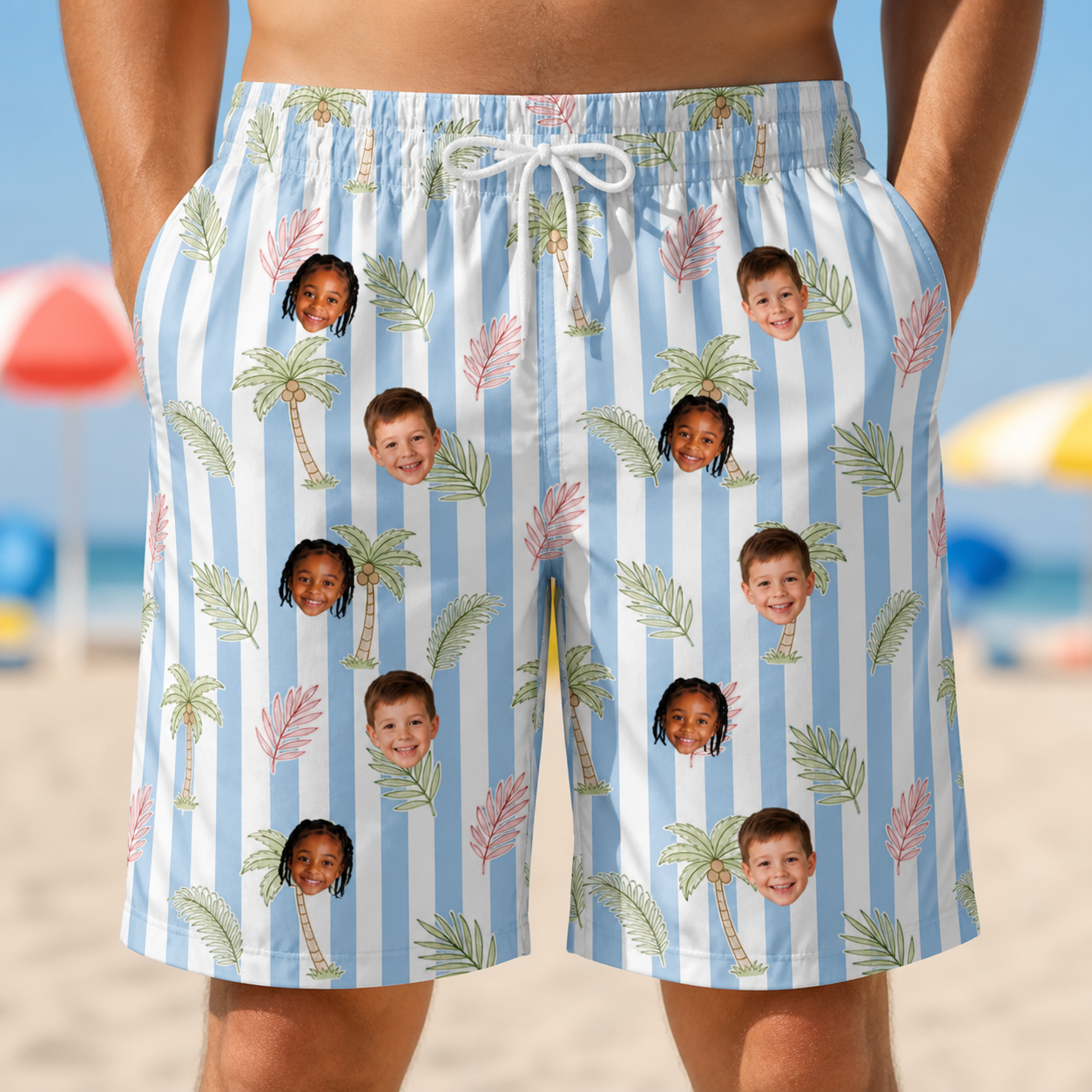 Model wearing Men's Frond Fandango Custom Face Beach Shorts printed with kids' faces