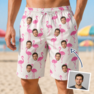 Man wearing Men's Bubblegum Ballerinas Custom Face Beach Shorts — custom faces printed all-over