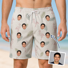 Man wearing Men's Tropical Tippytoes Custom Face Beach Shorts — custom faces printed all-over
