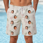 Model wearing Men's Tropical Tippytoes Custom Face Beach Shorts printed with kids' faces