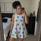 Real-life photo of someone wearing Women's Flamingo Fizz Custom Face Tank Dress — custom faces printed all-over