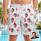 Man wearing Men's Pink Pours Custom Face Beach Shorts — custom faces printed all-over