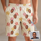 Man wearing Men's Hibiscus Hustle Custom Face Beach Shorts — custom faces printed all-over