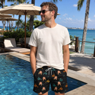 Real-life photo of someone wearing Men's Spool Foolery Custom Face Beach Shorts — custom faces printed all-over