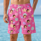 Model wearing Men's Fuchsia Flock Custom Face Beach Shorts printed with kids' faces