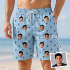 Man wearing Men's Palm Parasol Custom Face Beach Shorts — custom faces printed all-over