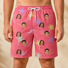 Model wearing Men's Paradise Punch Custom Face Beach Shorts printed with kids' faces