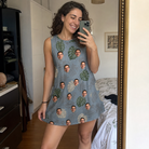 Real-life photo of someone wearing Women's Monstera Mingle Custom Face Tank Dress — custom faces printed all-over