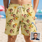 Man wearing Men's Frangipani Frolic Custom Face Beach Shorts — custom faces printed all-over