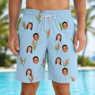 Model wearing Men's Heliconia Hooray Custom Face Beach Shorts printed with kids' faces