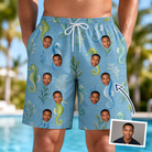 Man wearing Men's Sea Pony Society Custom Face Beach Shorts — custom faces printed all-over