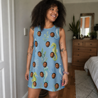 Real-life photo of someone wearing Women's Sea Pony Society Custom Face Tank Dress — custom faces printed all-over