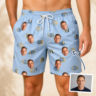 Man wearing Men's Aquatic Antics Custom Face Beach Shorts — custom faces printed all-over