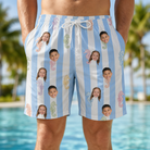 Model wearing Men's Seahorse Serenade Custom Face Beach Shorts printed with kids' faces