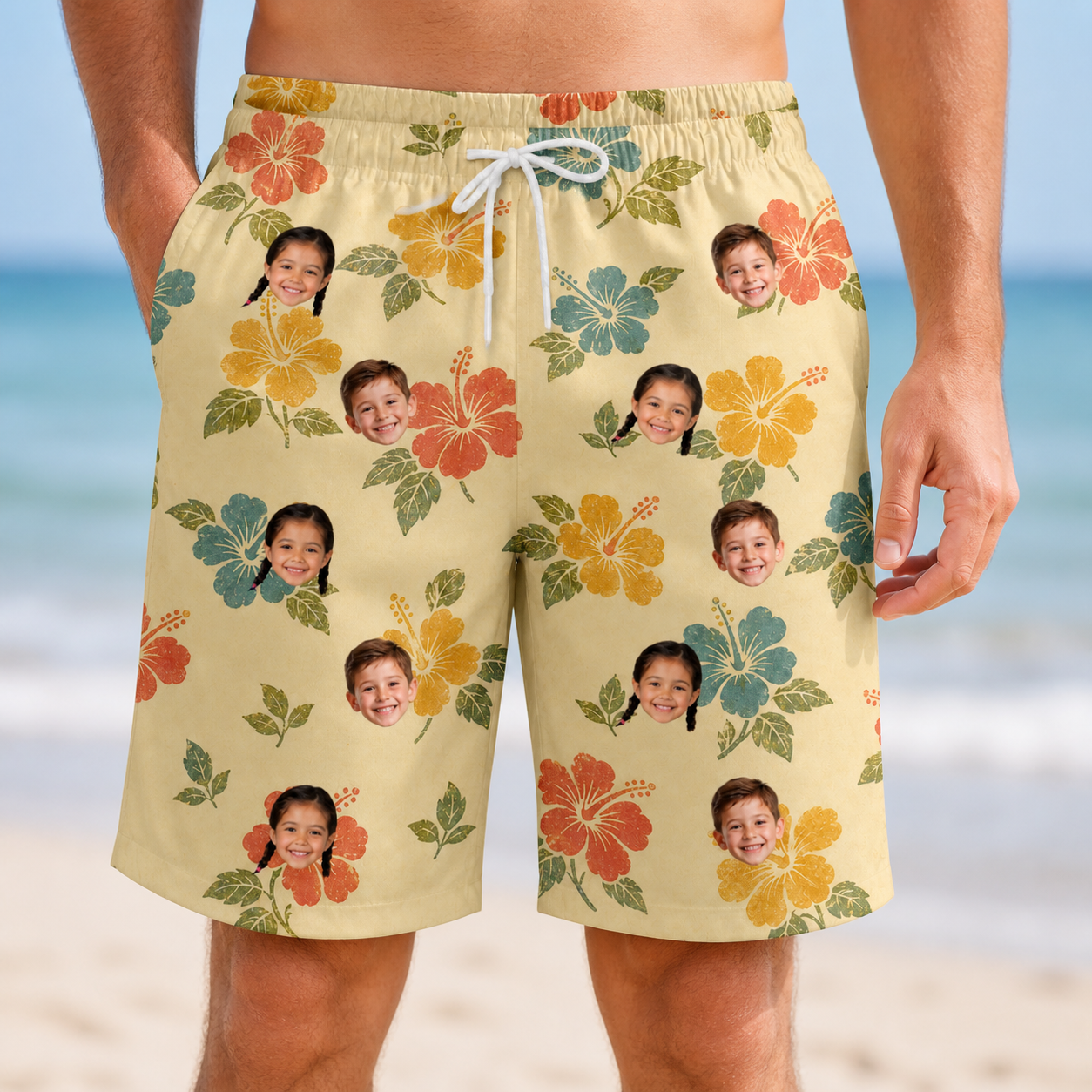 Model wearing Men's Atomic Atoll Custom Face Beach Shorts printed with kids' faces