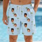 Model wearing Men's Chrome Fronds Custom Face Beach Shorts printed with kids' faces