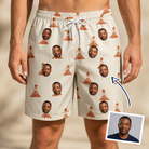 Man wearing Men's Magma Mambo Custom Face Beach Shorts — custom faces printed all-over