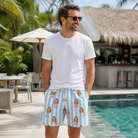 Real-life photo of someone wearing Men's Orchard Oddball Custom Face Beach Shorts — custom faces printed all-over