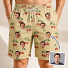 Man wearing Men's Cherry Chomp Custom Face Beach Shorts — custom faces printed all-over
