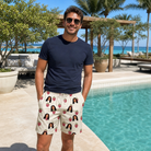 Real-life photo of someone wearing Men's Raspberry Rhapsody Custom Face Beach Shorts — custom faces printed all-over